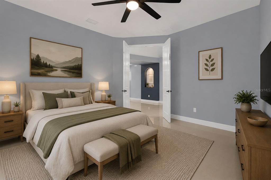 A bedroom features a bed with olive green accents, a ceiling fan, and double doors — 1926 MENDOCINO LANE, PORT ORANGE, FL
