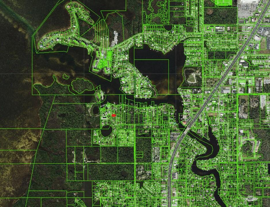 This is a map showing property parcel boundaries over a residential area with water features — 4824 DOWELL DRIVE, PORT RICHEY, FL