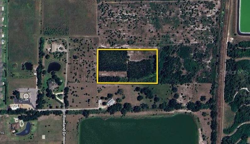This is an aerial map view of a rectangular plot of land highlighted in yellow — 3321 ROWLAND DRIVE UNIT Tract E, PUNTA GORDA, FL