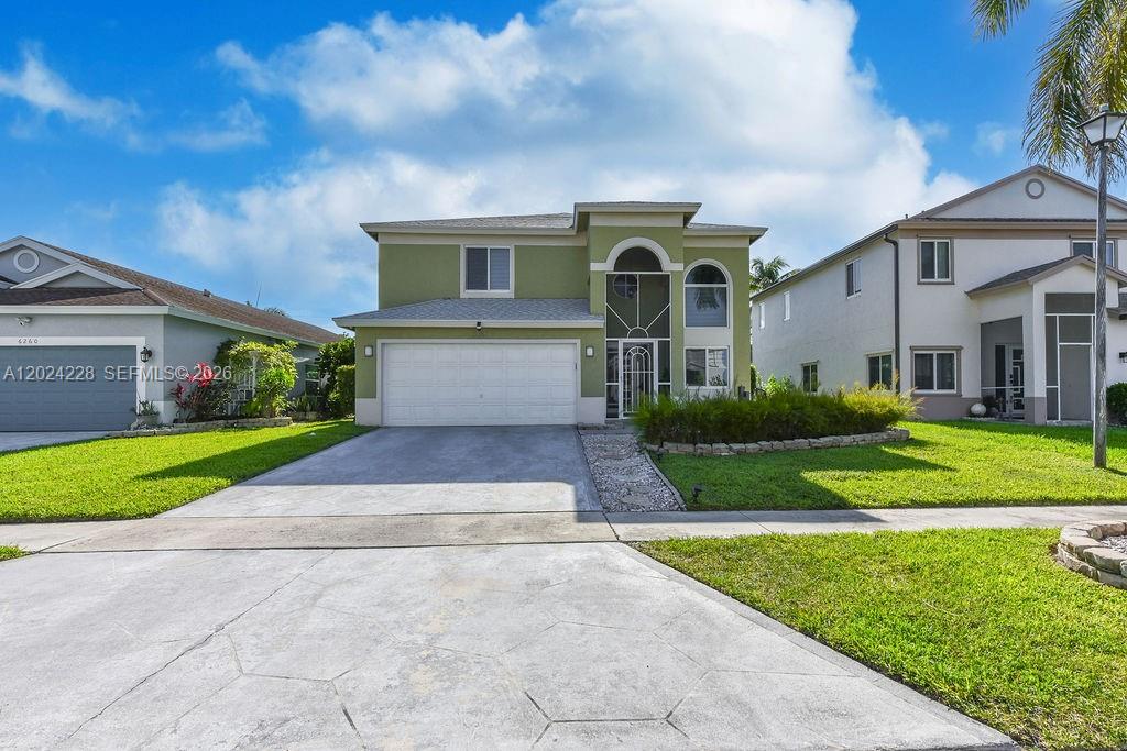 A dining room with high ceilings, large windows, tile flooring, and a modern table set — 6256 Lansdowne Cir, Boynton Beach FL 33472, BOYNTON BEACH, FL