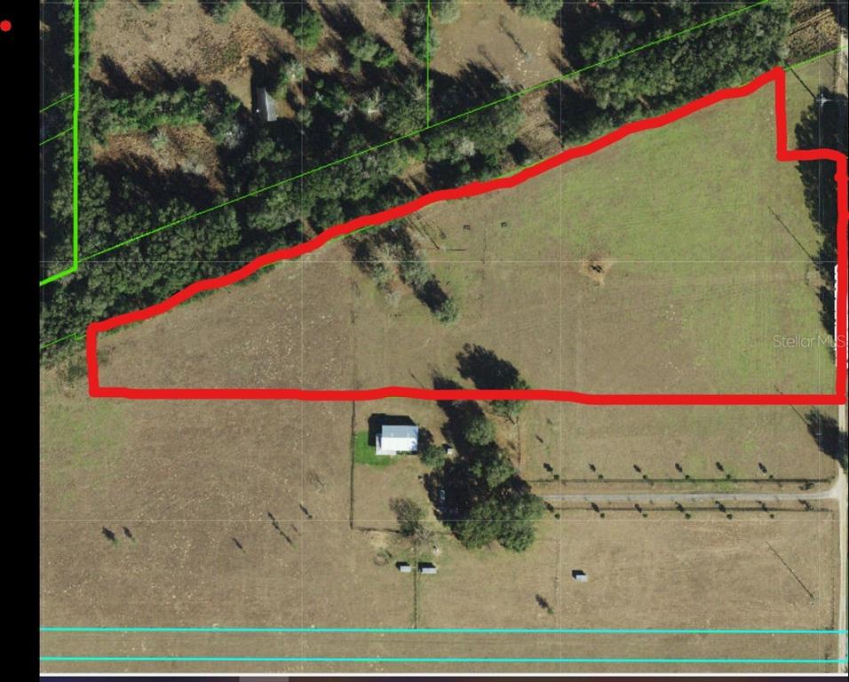 An aerial map shows a parcel of land outlined in red within a rural area — 0 POWERLINE ROAD, DADE CITY, FL