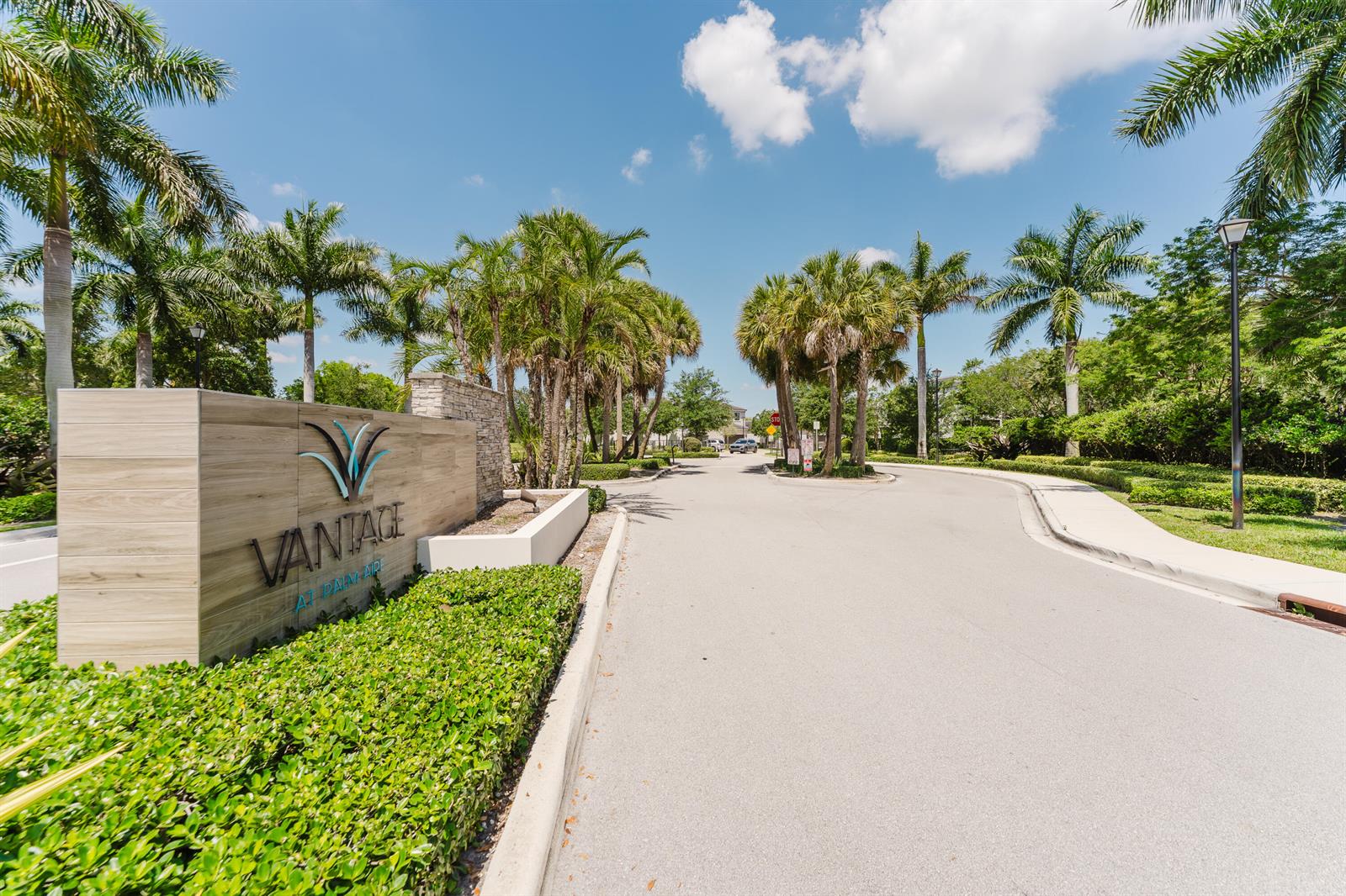 A sign for Vantage at Palm Aire stands at the entrance to a paved road — 295 NW 33rd Lane, Pompano Beach FL 33069, POMPANO BEACH, FL