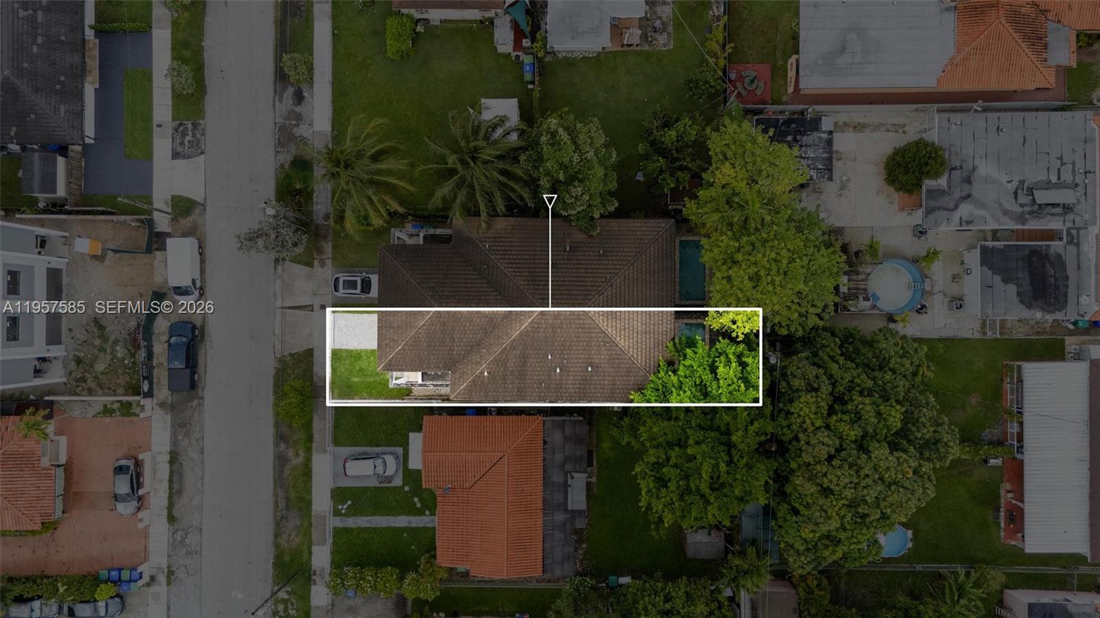 This aerial view shows a residential property with a tiled roof and a swimming pool — 2784 SW 34th Ave, Miami FL 33133, MIAMI, FL
