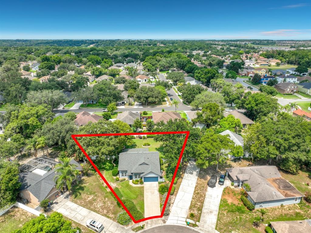 An aerial view shows a single-story house with a red outline highlighting its property boundaries — 6609 PINEKNOT COURT, OCOEE, FL