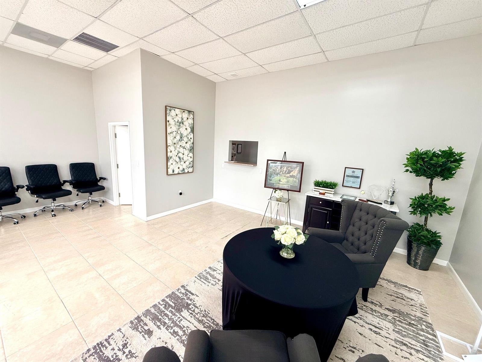 A waiting area features tile flooring, a round table with chairs, and neutral wall paint — 1490 N State Road 7 # B, Margate FL 33063, MARGATE, FL