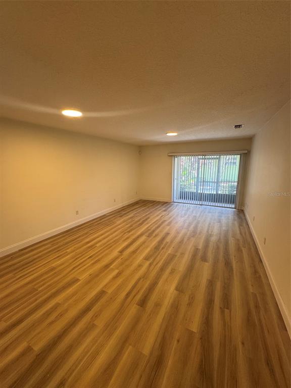 A kitchen with white cabinets, stainless steel appliances, and light-colored countertops — 2317 SUN VALLEY CIRCLE UNIT 2317, WINTER PARK, FL