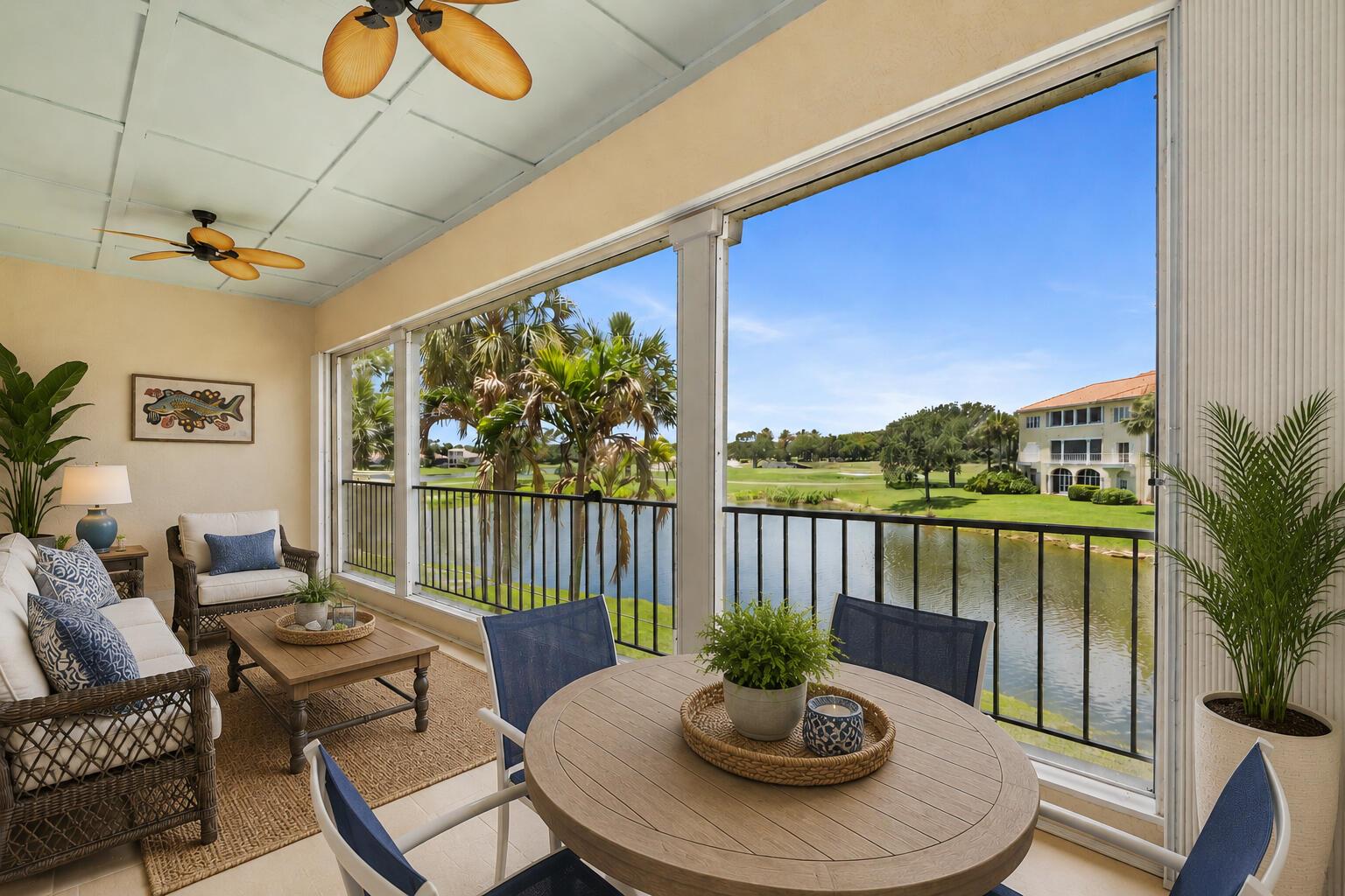 A screened-in porch features wicker furniture, a dining set, and views of a golf course — 5045 Harmony Circle # 209, Vero Beach FL 32967, VERO BEACH, FL