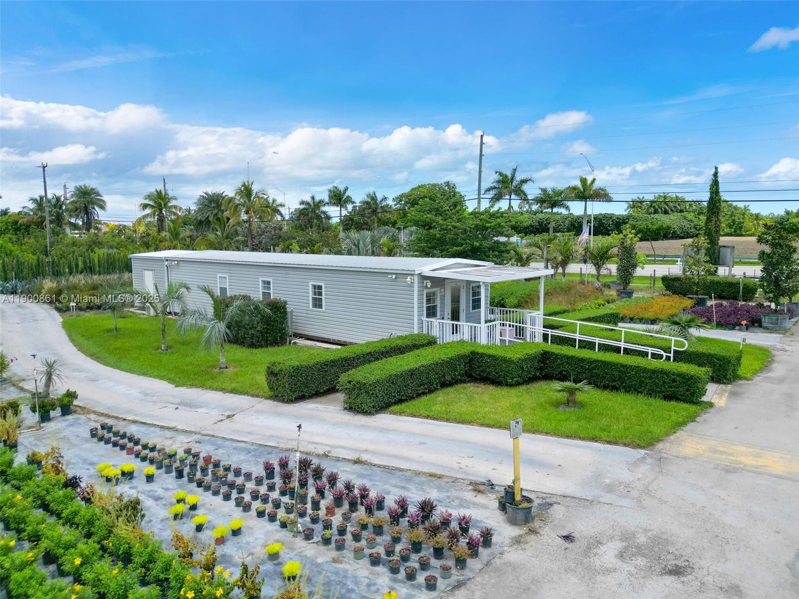 An aerial view shows a light-gray mobile home with a white porch and wheelchair ramp — 19000 SW KROME AKA 177 AVE, Miami FL 33187, MIAMI, FL