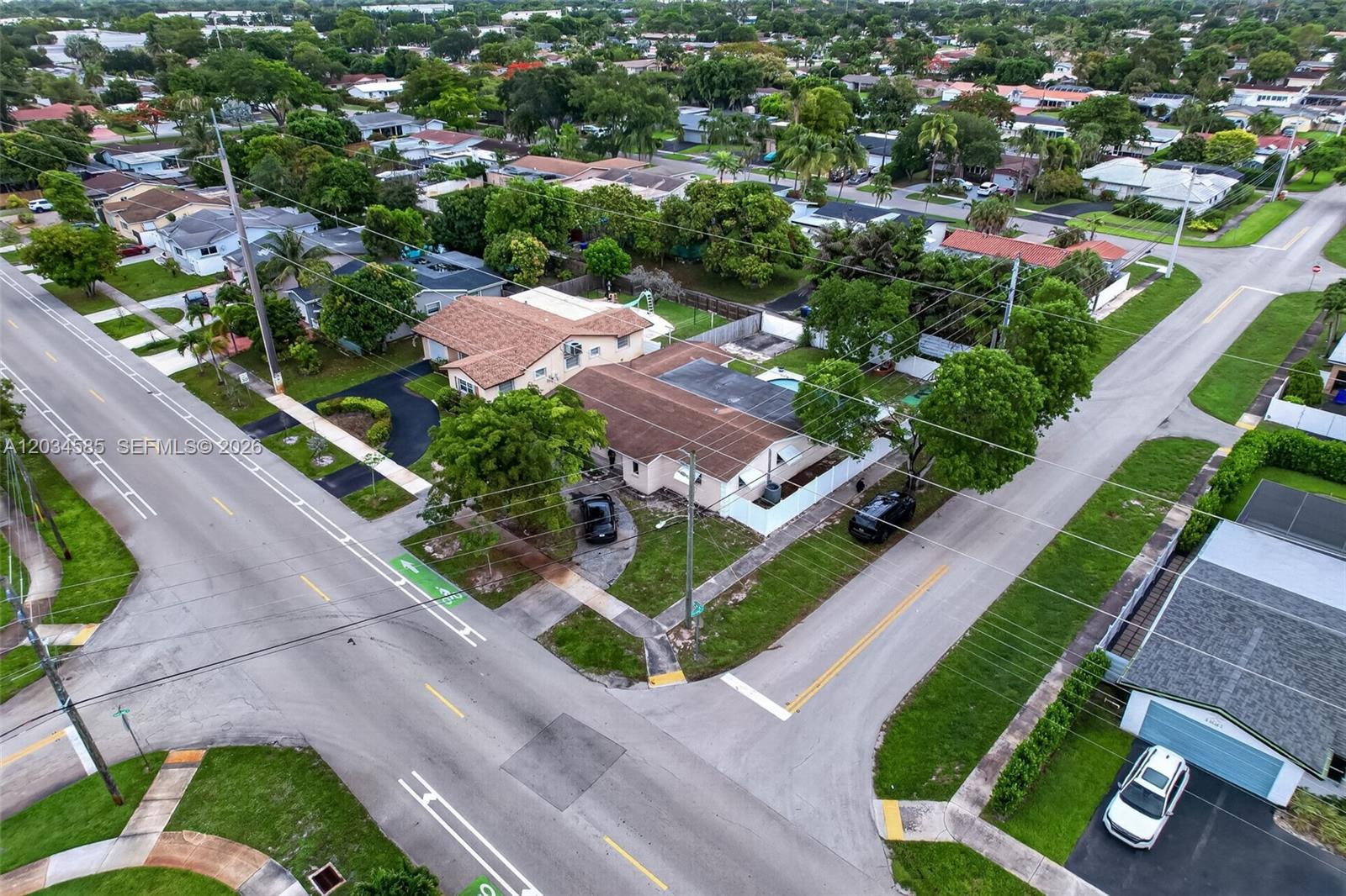 An aerial view shows a residential corner lot with two houses and surrounding streets — 1901 N 56th Ave, Hollywood FL 33021, HOLLYWOOD, FL