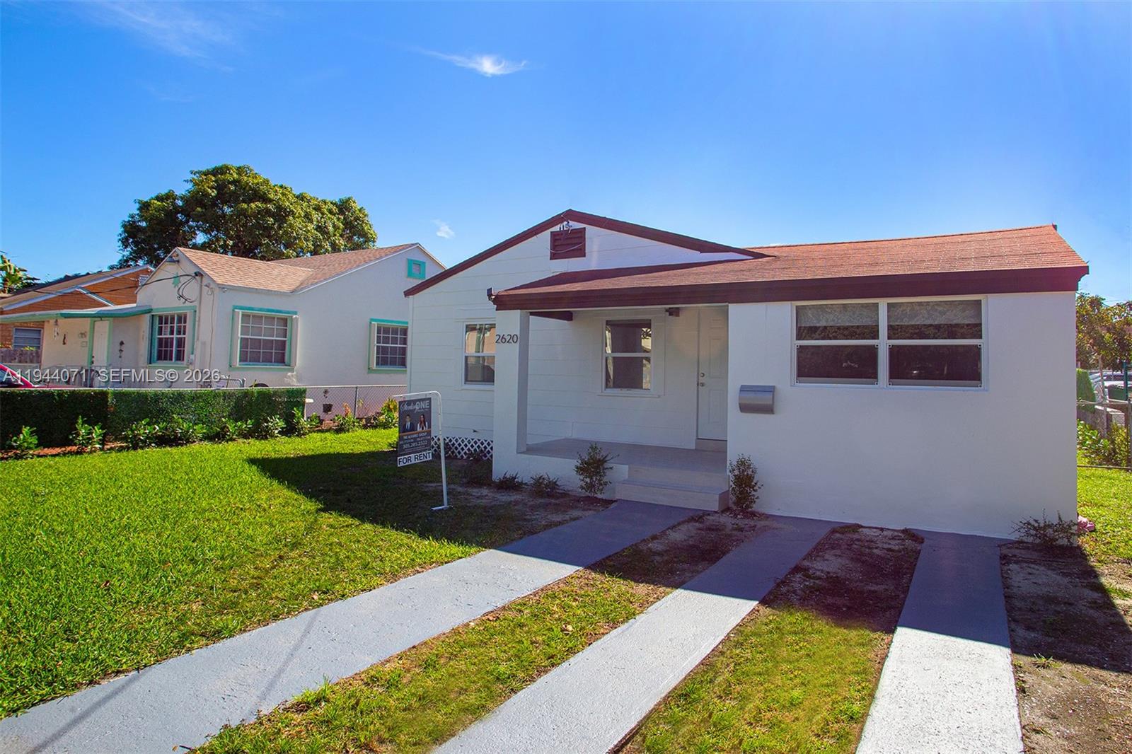 A white single-story house with a brown roof and a concrete driveway — 2620 SW 9th St, Miami FL 33135, MIAMI, FL