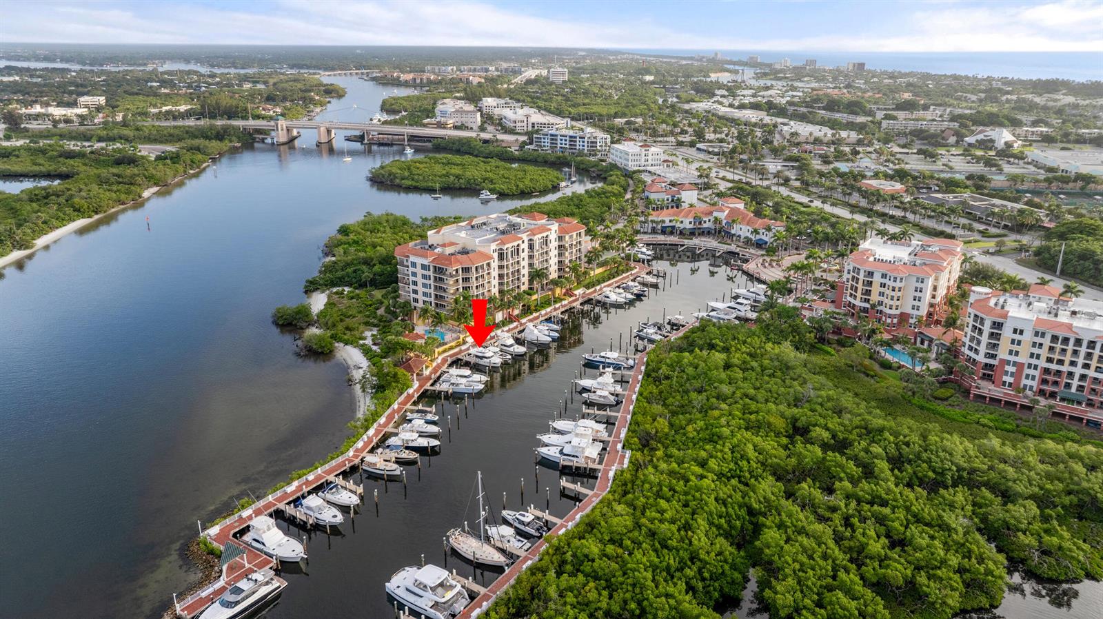 An aerial view shows a marina with multiple boats docked beside a large residential complex — 348 S Us Hwy 1, 17, Jupiter FL 33477, JUPITER, FL