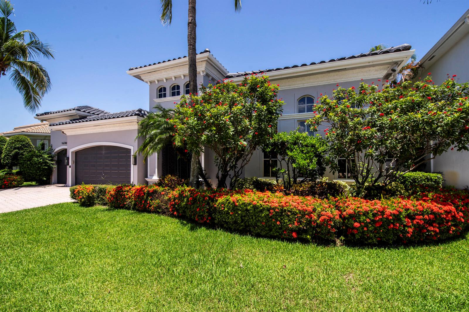 A two-story house with a gray exterior, a tiled roof, and a landscaped front yard — 16340 Via Venetia E, Delray Beach FL 33484, DELRAY BEACH, FL