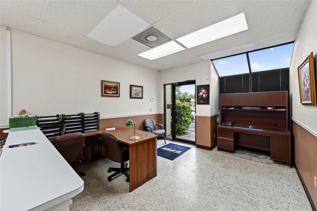An office space features a desk, a hutch, a glass door, and a drop ceiling — 3632 CENTRAL AVENUE, ST PETERSBURG, FL