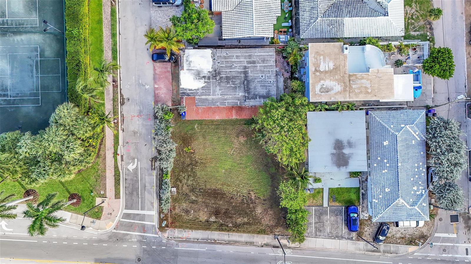 An aerial view shows a vacant rectangular lot situated between two residential buildings and a road — 356 Balboa Street, Hollywood FL 33019, HOLLYWOOD, FL