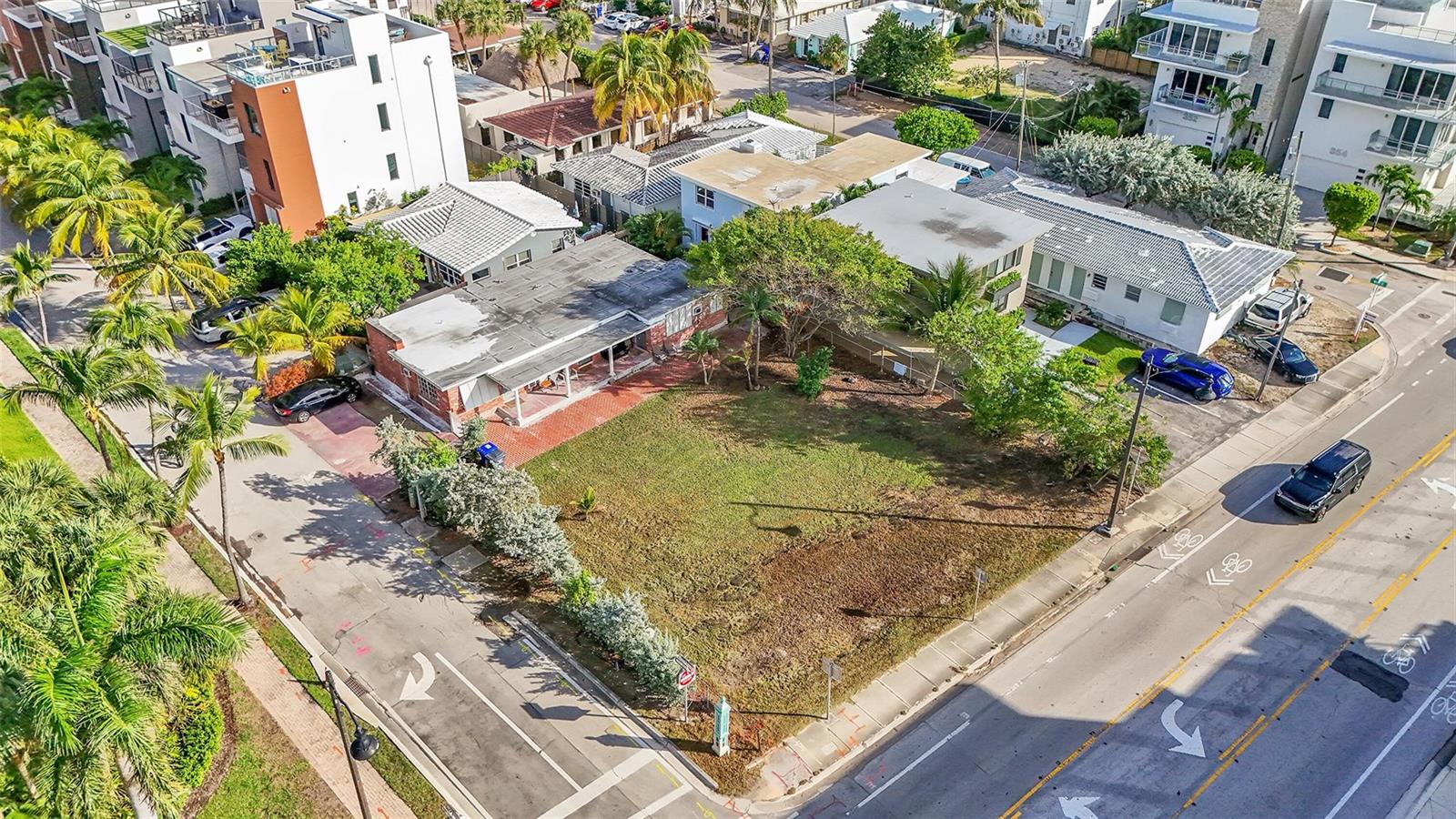 An aerial view shows a corner lot with a single-story house and adjacent vacant land — 356 Balboa Street, Hollywood FL 33019, HOLLYWOOD, FL