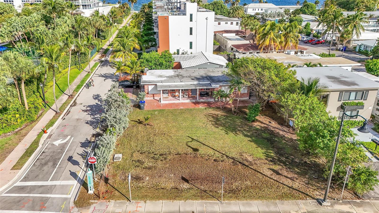An aerial view of a single-story house with a large front lawn and brick patio — 356 Balboa Street, Hollywood FL 33019, HOLLYWOOD, FL