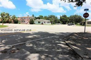 A street view shows a paved intersection with a stop sign and nearby residential houses — 190 NE 90th St # 2, El Portal FL 33138, EL PORTAL, FL