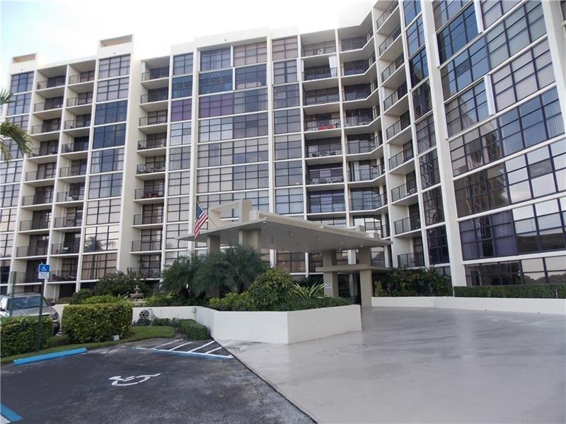 A multi-story apartment building with a covered entrance and a paved parking area — 600 Parkview Drive # 531, Hallandale Beach FL 33009, HALLANDALE BEACH, FL