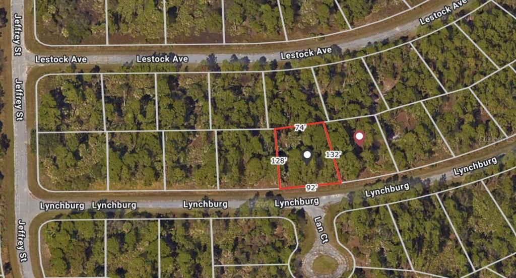 This is an aerial map view of a vacant residential lot outlined in red — LYNCHBURG AVENUE, NORTH PORT, FL
