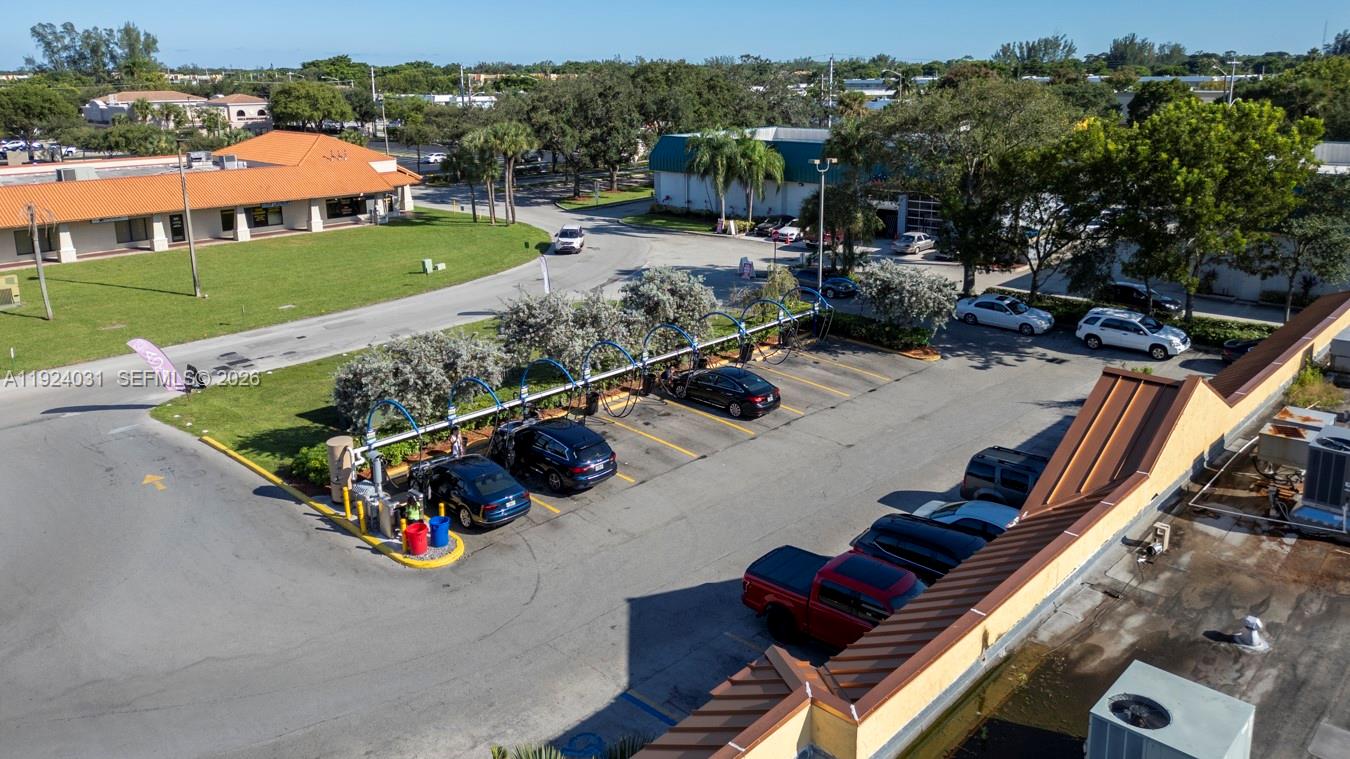 An aerial view shows a car wash station with several vehicles parked in the bays — 23133 Sandalfoot Plaza Dr, Boca Raton FL 33428, BOCA RATON, FL