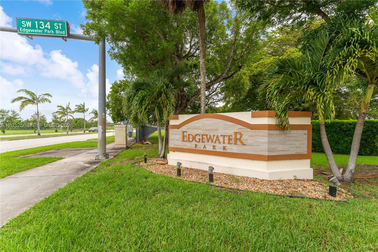 A stone monument sign for Edgewater Park stands on a grassy lawn near a street — 13332 SW 113th Ct, Miami FL 33176, MIAMI, FL