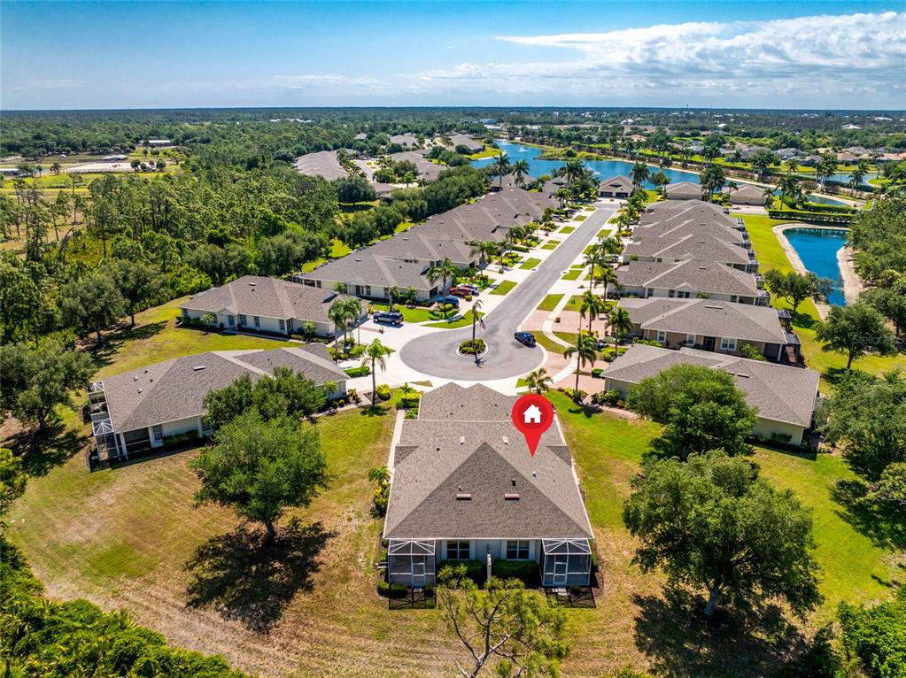 An aerial view shows a residential neighborhood with a cul-de-sac and a marked house — 29633 NIAGARA COURT, ENGLEWOOD, FL