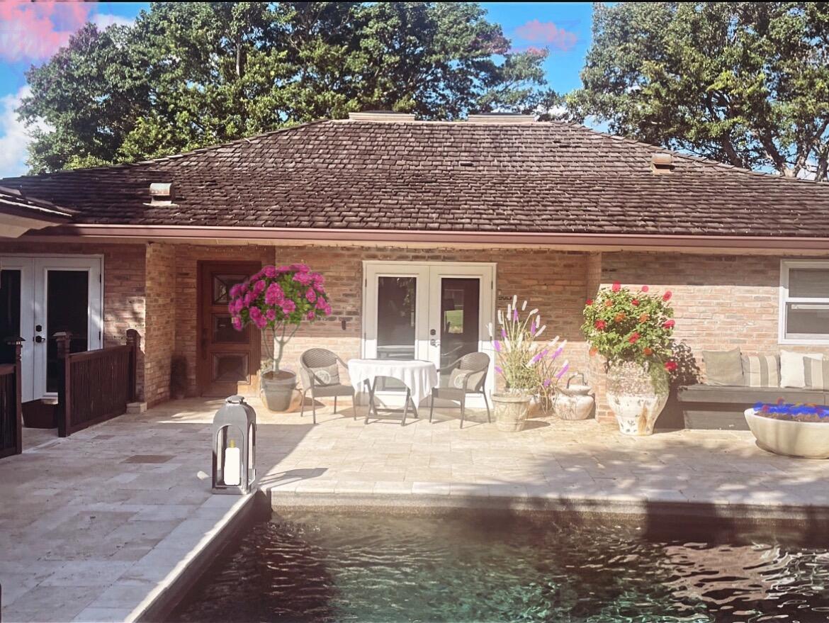 This is a digital rendering of a brick patio with a pool and outdoor seating — 2107 Wightman Drive, Wellington FL 33414, WELLINGTON, FL