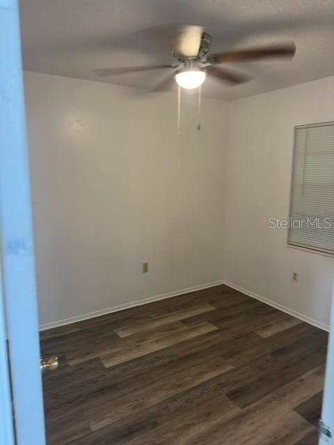 An empty bedroom features white walls, wood-look flooring, and a ceiling fan with light — 3648 MOUNT TABOR ROAD, LAKELAND, FL