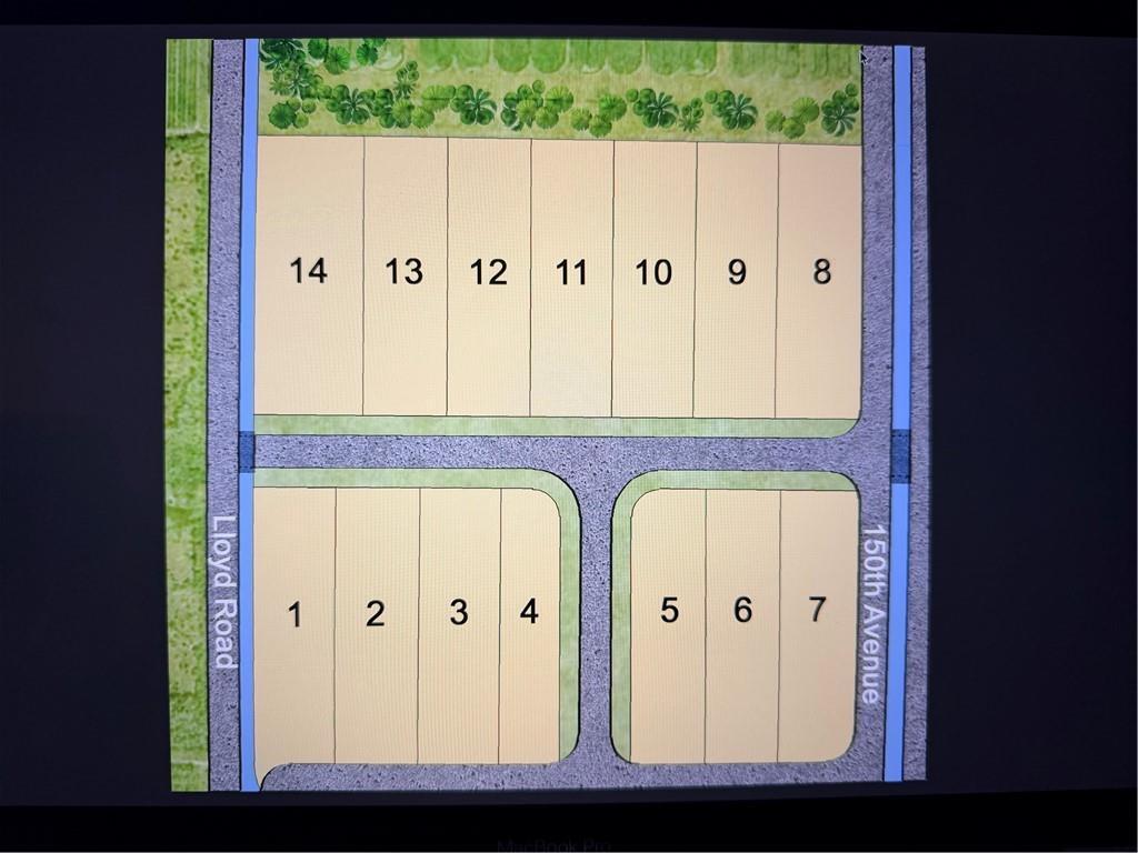 This is a site plan rendering showing fourteen numbered residential lots arranged along two streets — VERO BEACH, FL