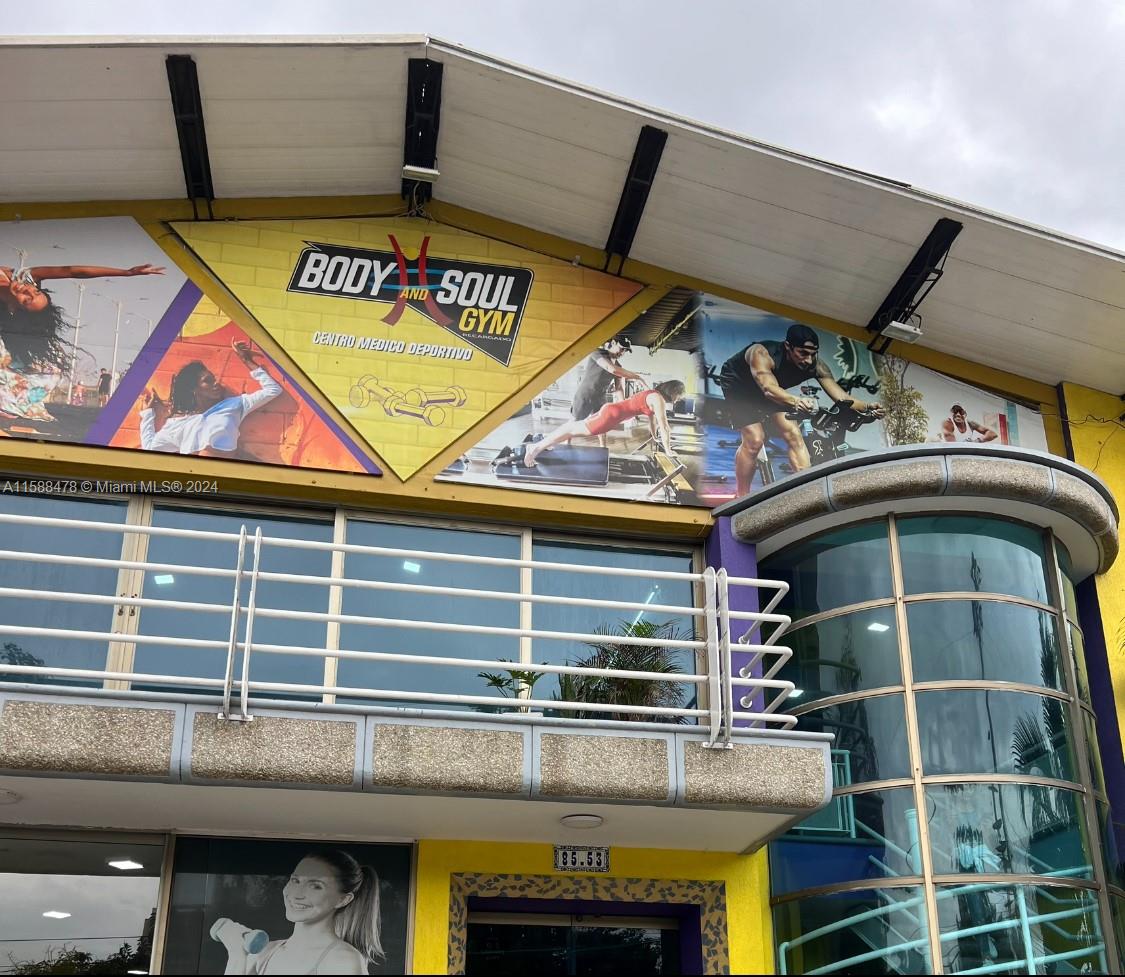 The exterior of a two-story building features a large sign for Body and Soul Gym — Carrera 64 85-53, 00000, FL