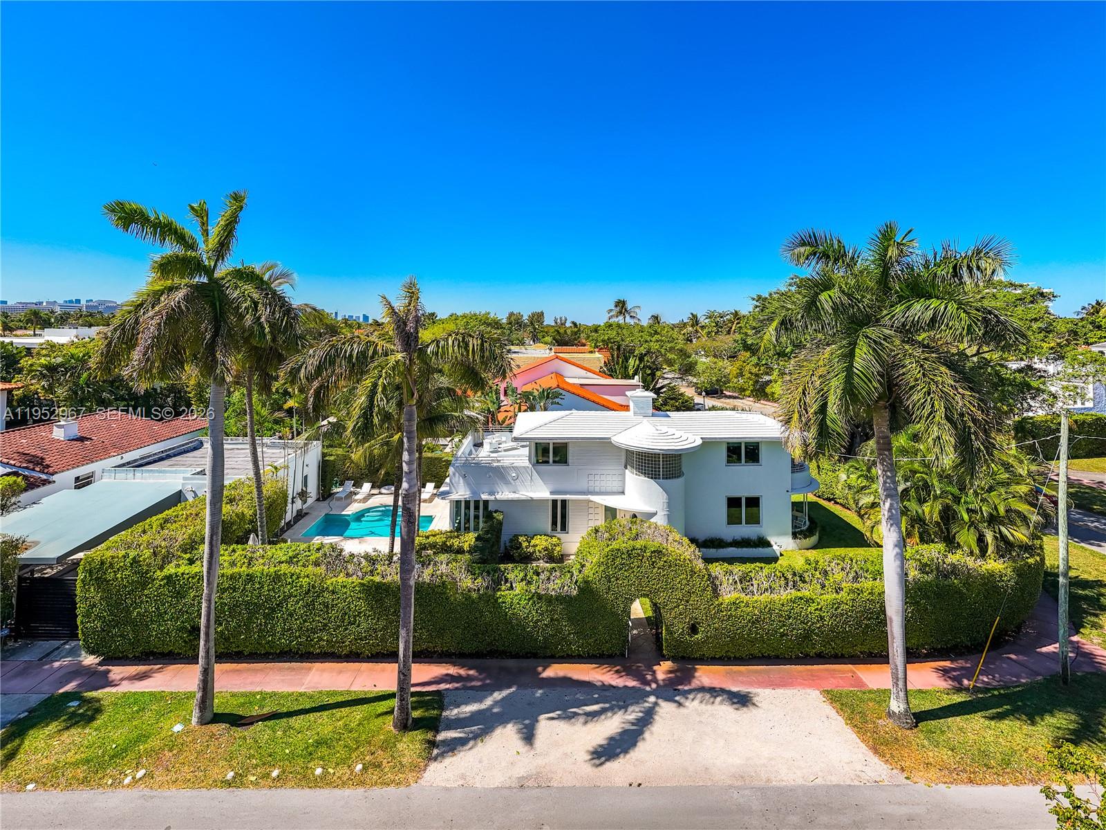 An aerial view shows a white two-story house with a pool and tall palm trees — 4580 Post Ave, Miami Beach FL 33140, MIAMI BEACH, FL