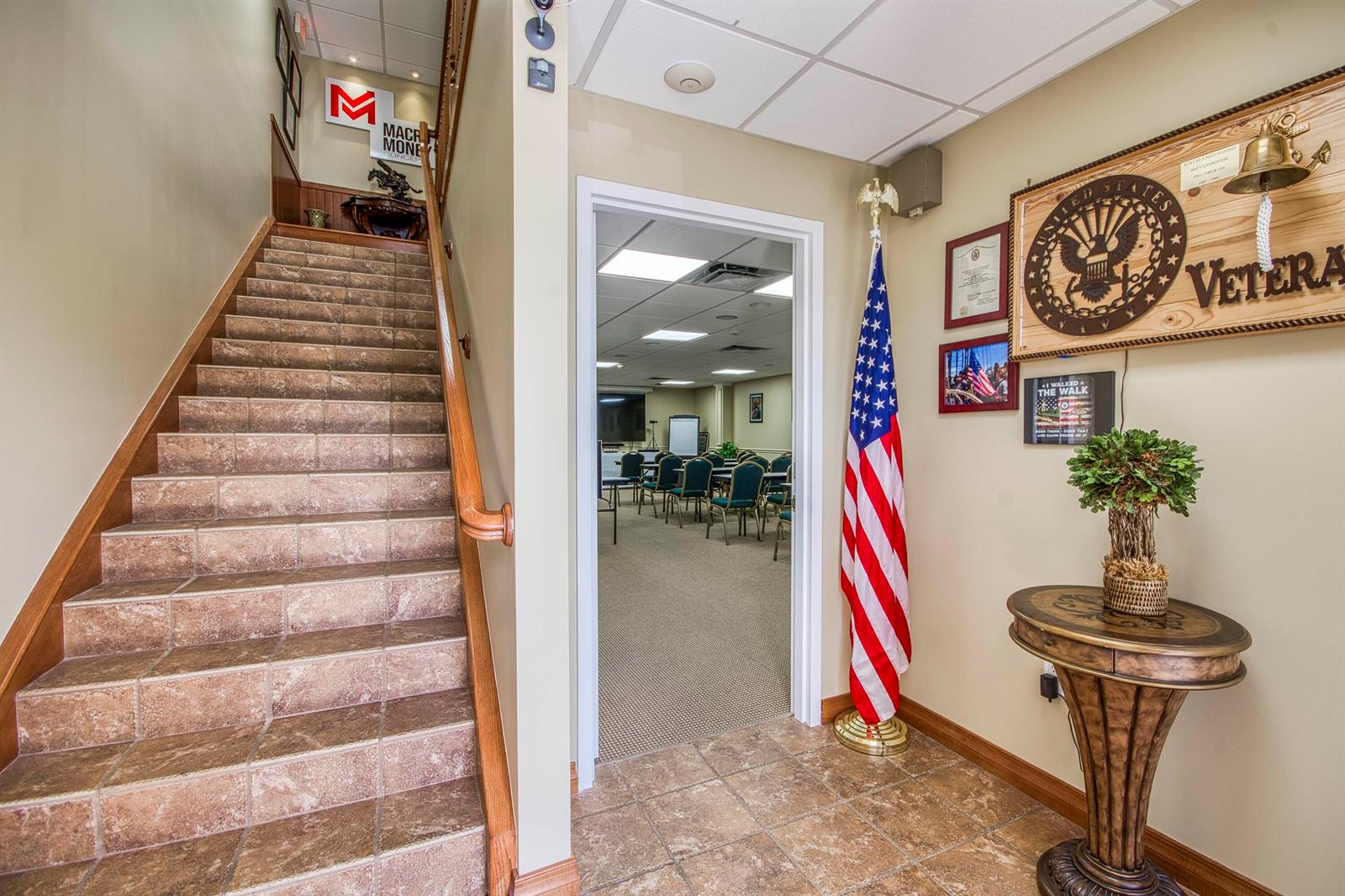 A tiled staircase leads upward next to a doorway opening into a carpeted meeting room — 2684 SE Willoughby Boulevard, Stuart FL 34994, STUART, FL