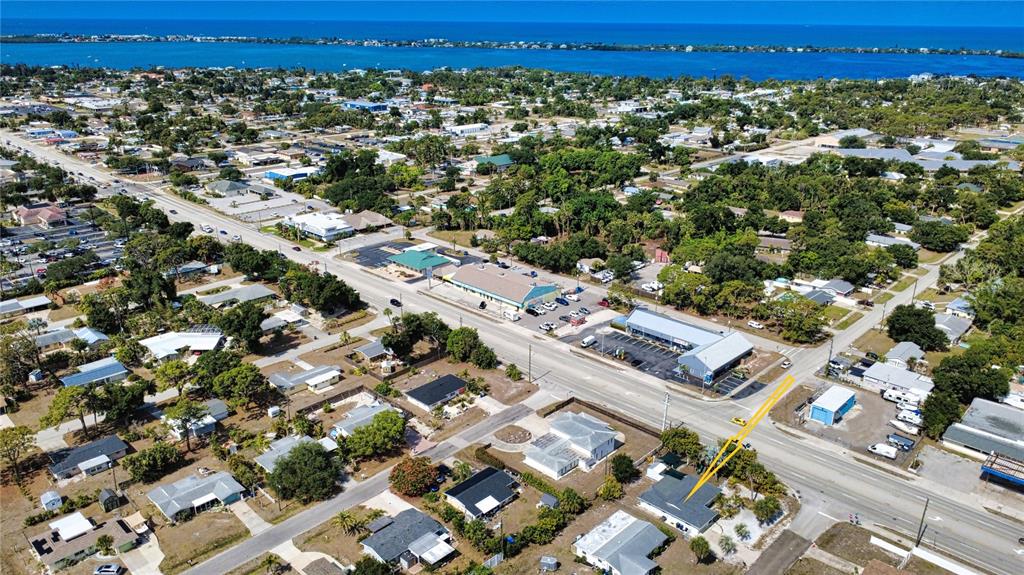 This is an aerial view of a residential neighborhood with a highlighted house — 1 CAROLL CIRCLE, ENGLEWOOD, FL