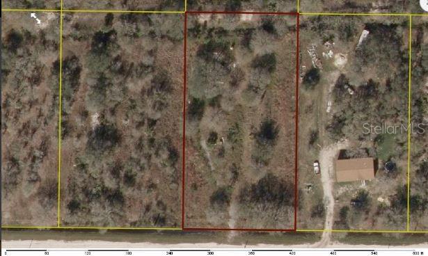 This aerial view shows a rectangular plot of land outlined in red — 17383 NW 264TH STREET, OKEECHOBEE, FL