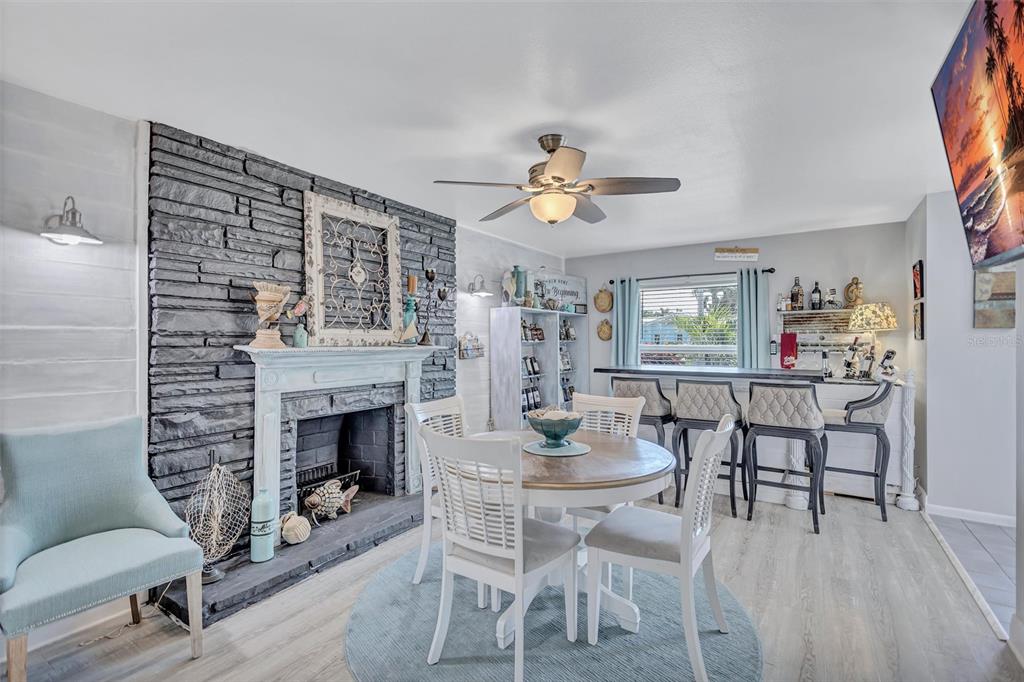 An entryway features a white front door, a blue dresser, and a model sailboat — 563 LEWIS BOULEVARD SE, ST PETERSBURG, FL