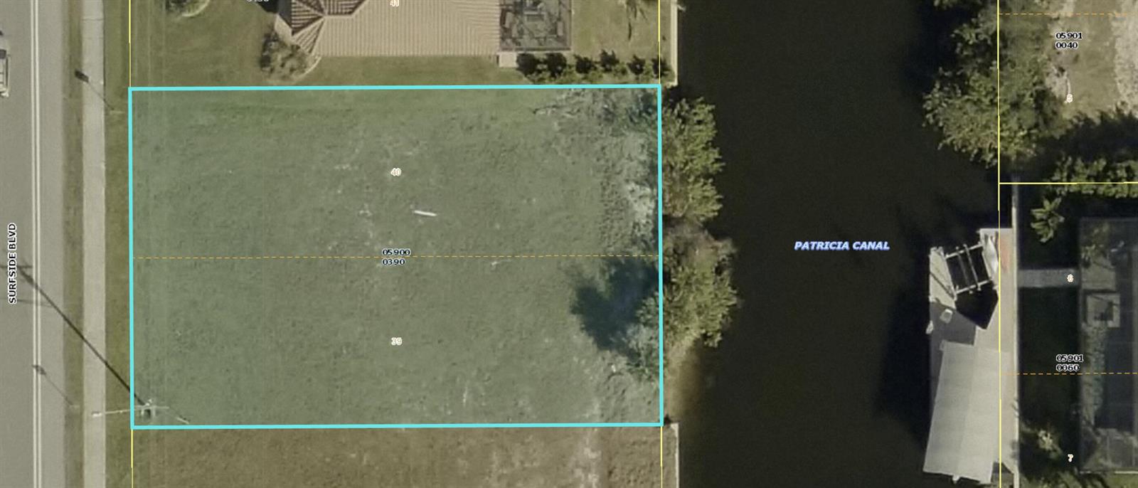 This is an aerial map showing a vacant waterfront lot bordering a canal and road — 2513 Surfside Boulevard, FL 33914, FL