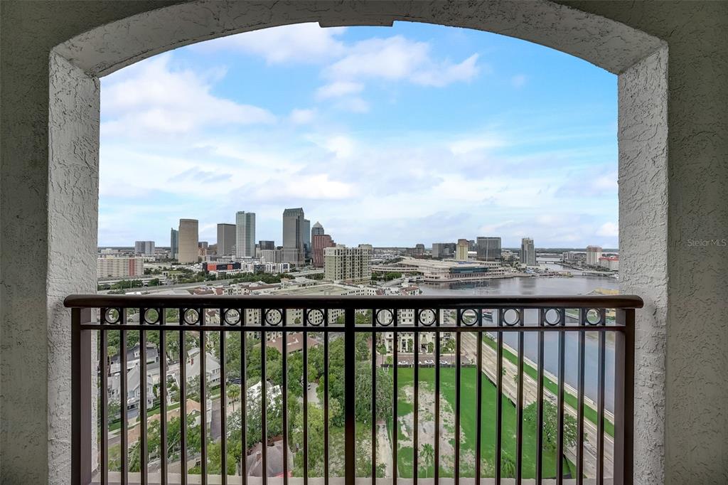 A balcony with a metal railing overlooks the Tampa skyline and the Hillsborough River — 345 BAYSHORE BOULEVARD UNIT GP06, TAMPA, FL