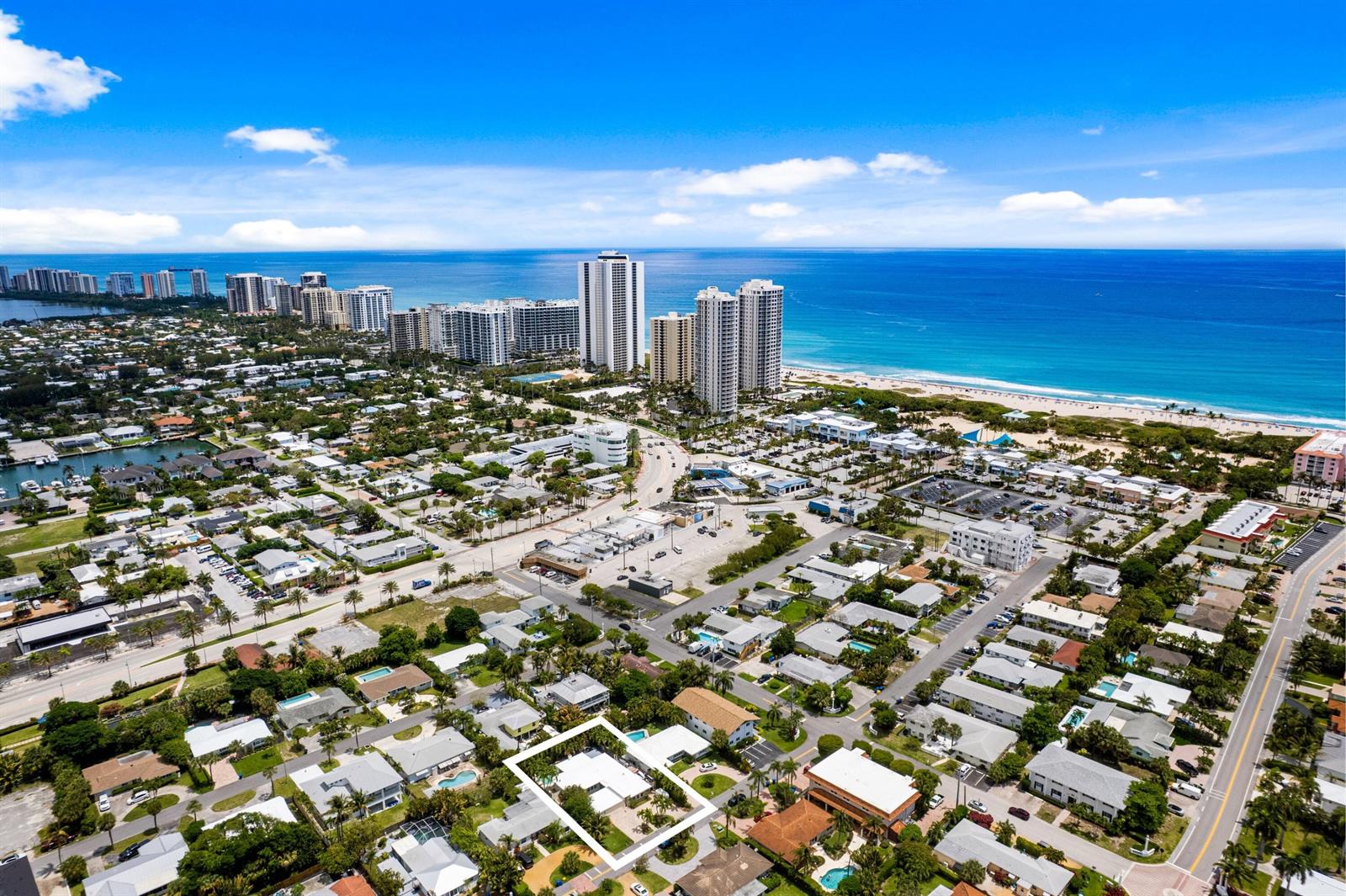 An aerial view of a coastal neighborhood with a highlighted single-family home in the foreground — 1166 Beach Road, Singer Island FL 33404, SINGER ISLAND, FL