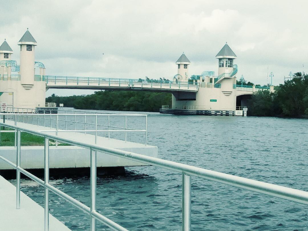A metal railing overlooks a waterway leading to a bridge with four decorative towers — 880 W Horizons # 111, Boynton Beach FL 33435, BOYNTON BEACH, FL