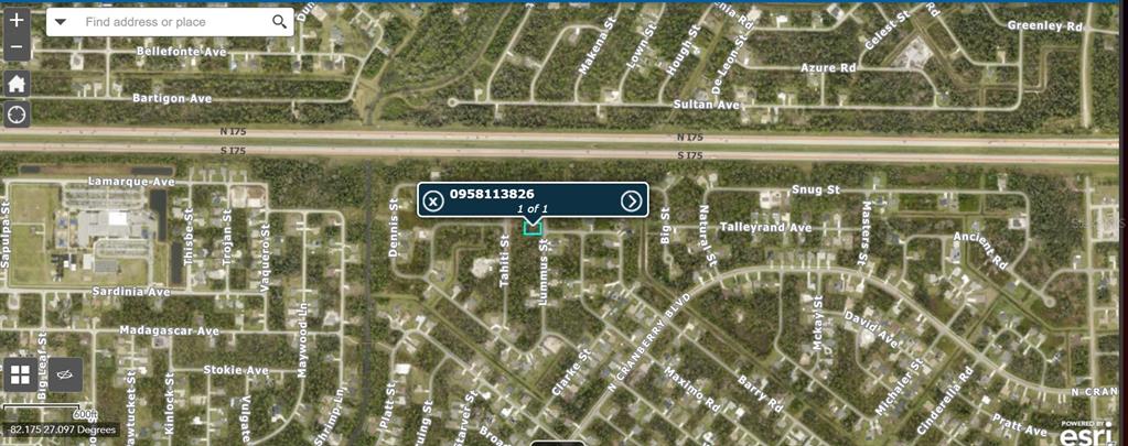 This is a satellite map showing a residential area with a highlighted property lot — LUMMUS STREET, NORTH PORT, FL