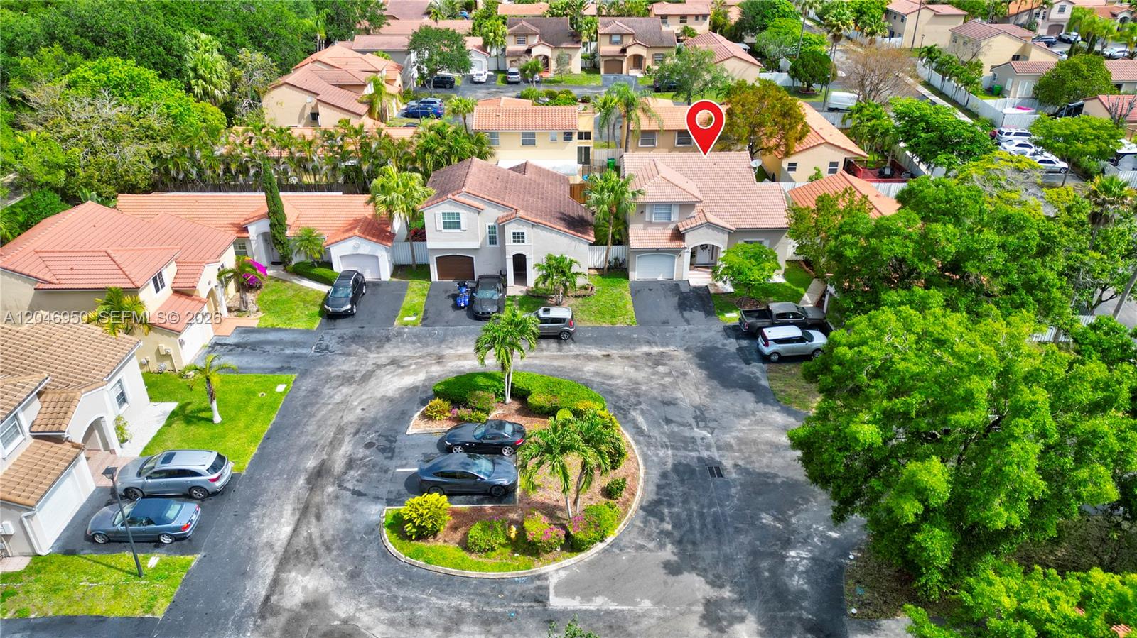An aerial view shows a residential neighborhood with houses, driveways, and a central parking island — 1237 NW 125th Ter, Sunrise FL 33323, SUNRISE, FL