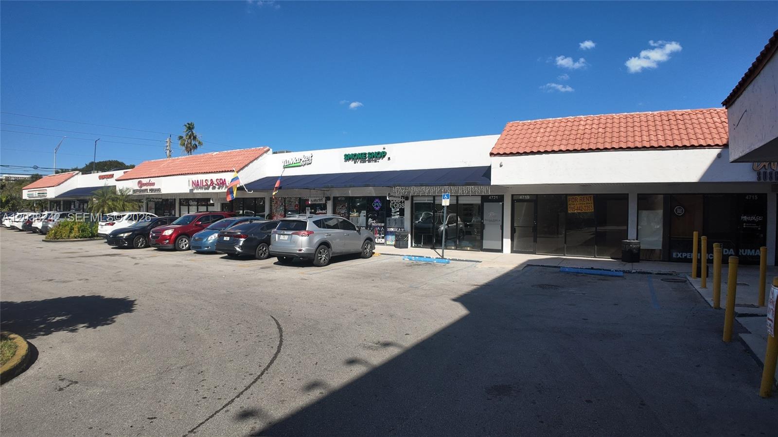 A strip mall exterior features a row of storefronts with a parking lot in front — 4721 NW 79th Ave, Doral FL 33166, DORAL, FL