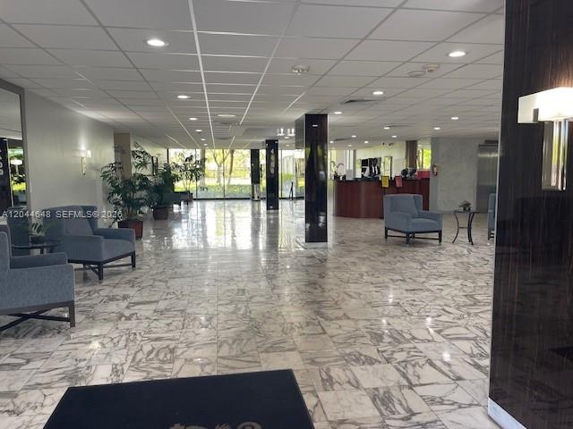 A spacious lobby features a marble floor, recessed lighting, and a reception desk — 4400 Hillcrest Dr # 701B, Hollywood FL 33021, HOLLYWOOD, FL