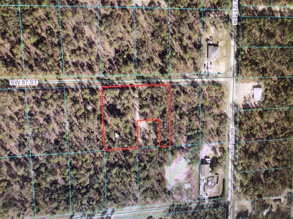 An aerial map shows a vacant, wooded lot outlined in red near a residential street — 0 SW 87 STREET, DUNNELLON, FL