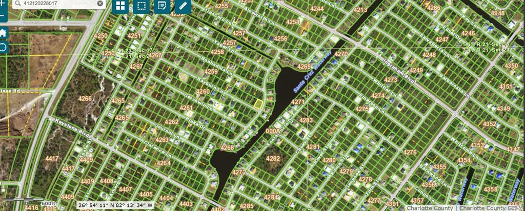 This is a satellite map view showing residential lots and a waterway in Charlotte County — 13468 RAYBURN LANE, PORT CHARLOTTE, FL