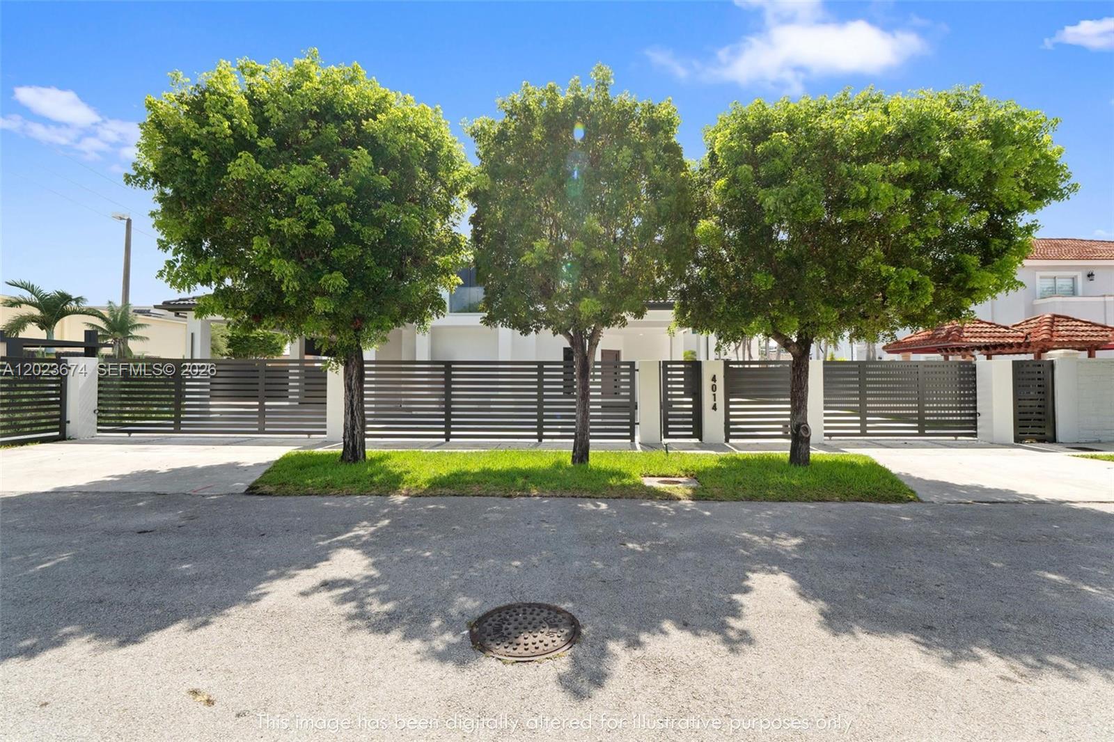 A modern house exterior features a dark horizontal slat fence and three mature trees — 4014 SW 144th Pl, Miami FL 33175, MIAMI, FL