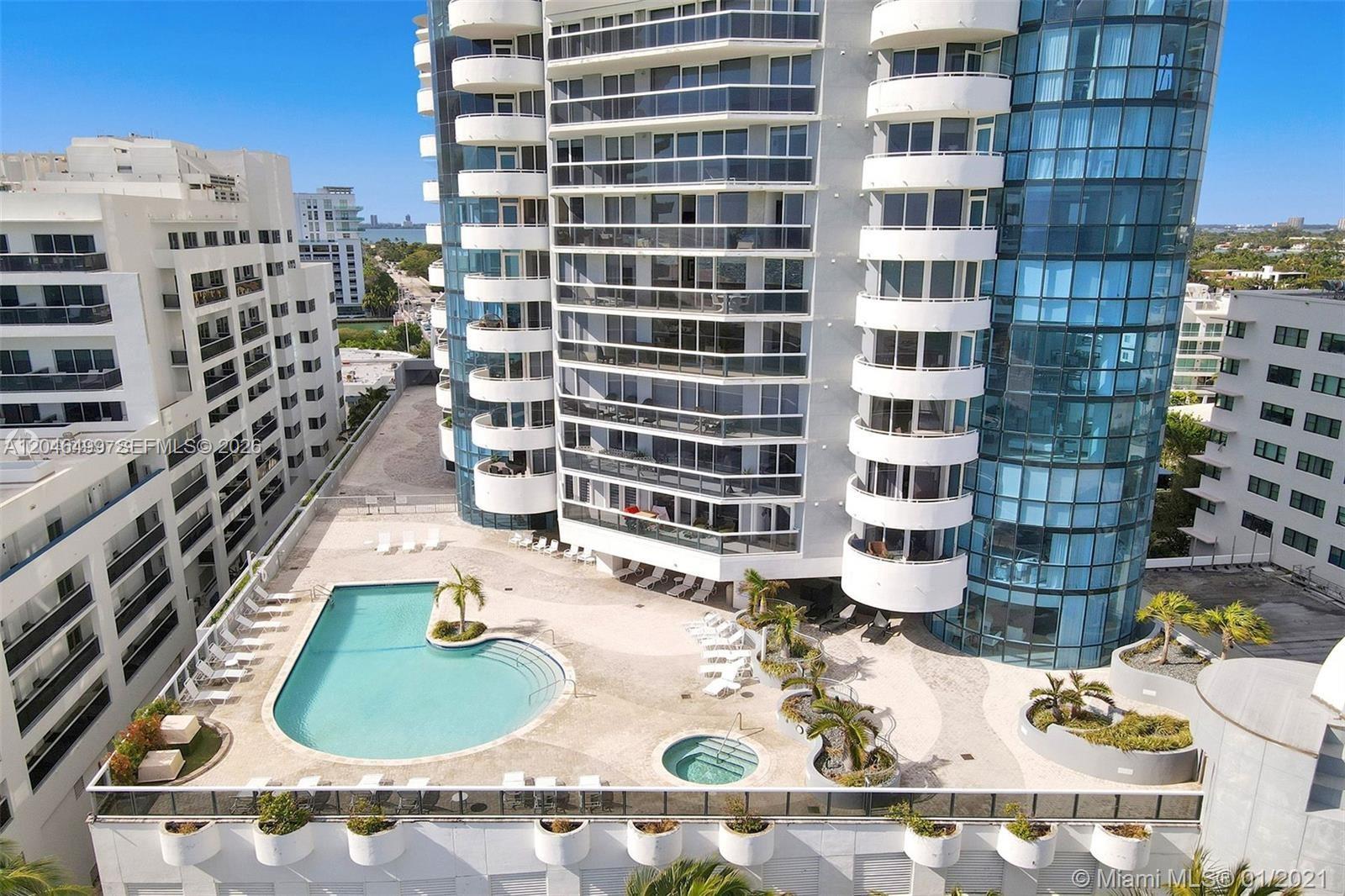 An aerial view of a high-rise building with a pool deck and hot tub — 6301 Collins Ave # 807, Miami Beach FL 33141, MIAMI BEACH, FL