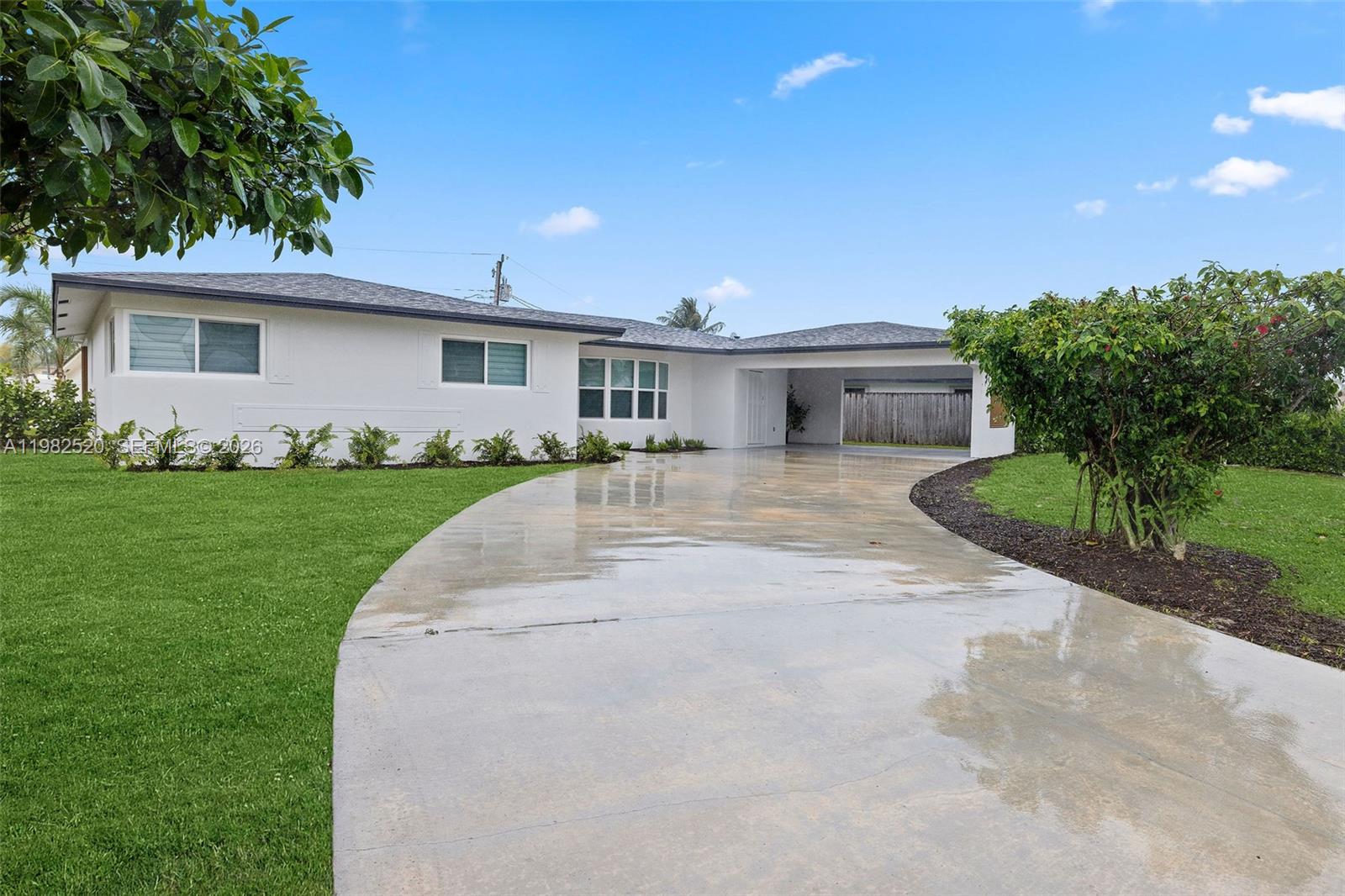 A white single-story house with a gray roof and a curved concrete driveway — 437 NW 13th Dr, Boca Raton FL 33486, BOCA RATON, FL