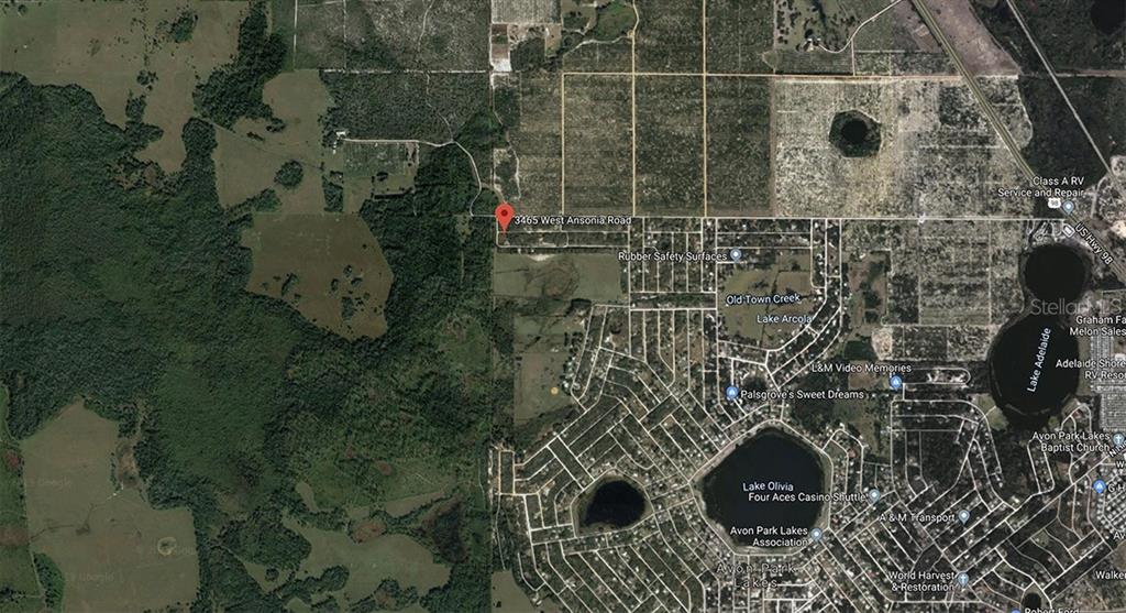 This is a satellite map view showing a residential area with lakes and surrounding land — 3465 W ANSONIA ROAD, AVON PARK, FL