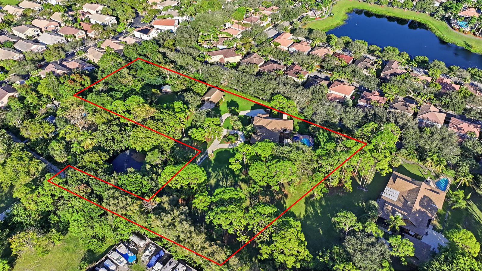 An aerial view shows a large, wooded residential property outlined in red with a swimming pool — 4838 Charlton Way, Delray Beach FL 33445, DELRAY BEACH, FL